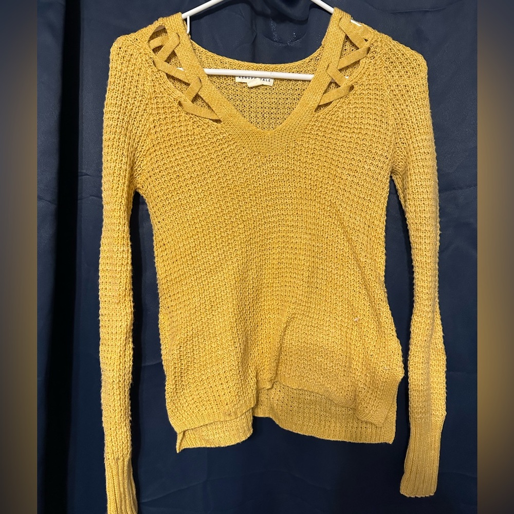 Aeropostale gold sweater cutout details